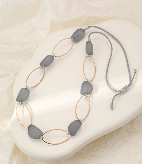 Grey Stones Necklace Gold: oval gray stone beads on gold rings with cord