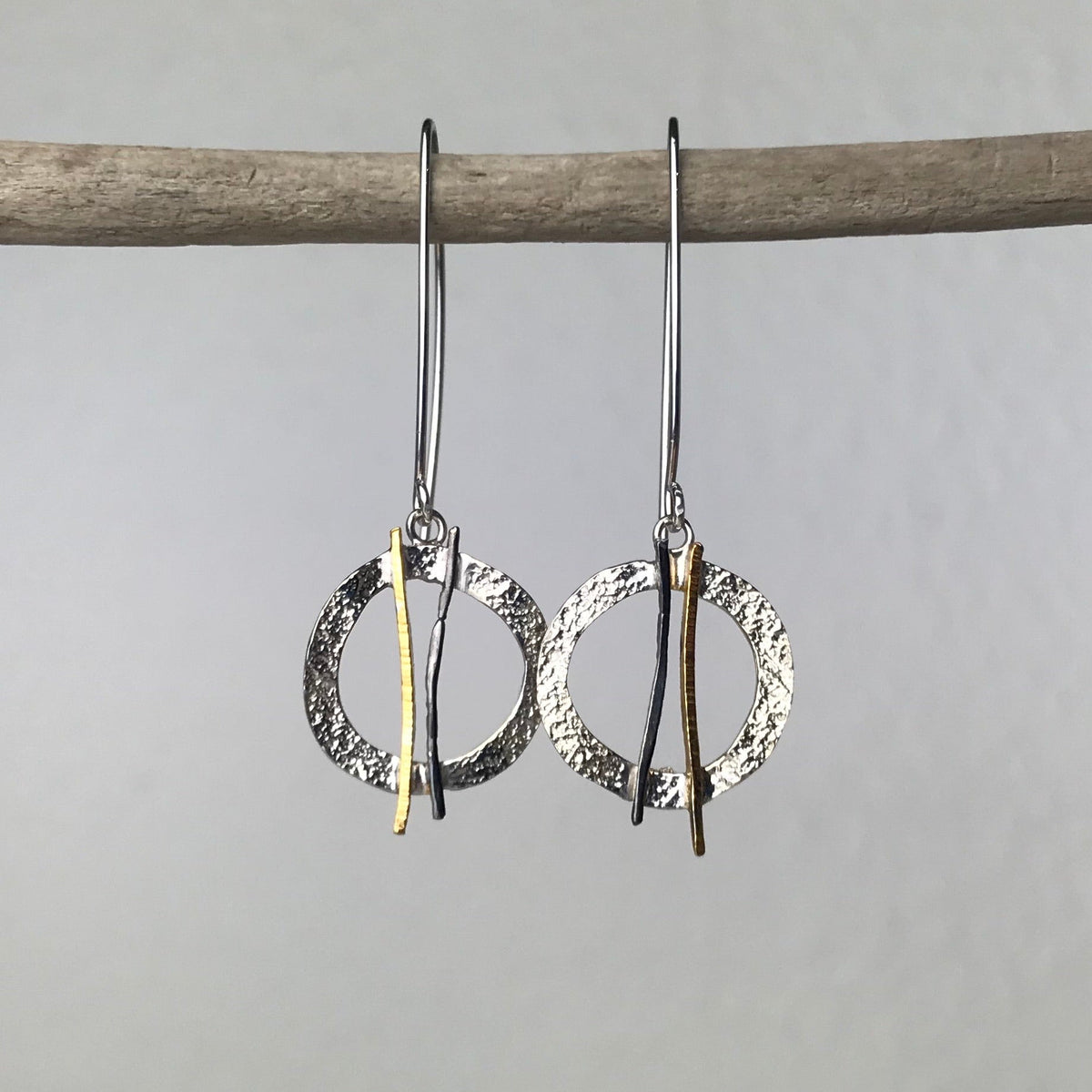 Silver and gold hammered circle earrings with vertical bars