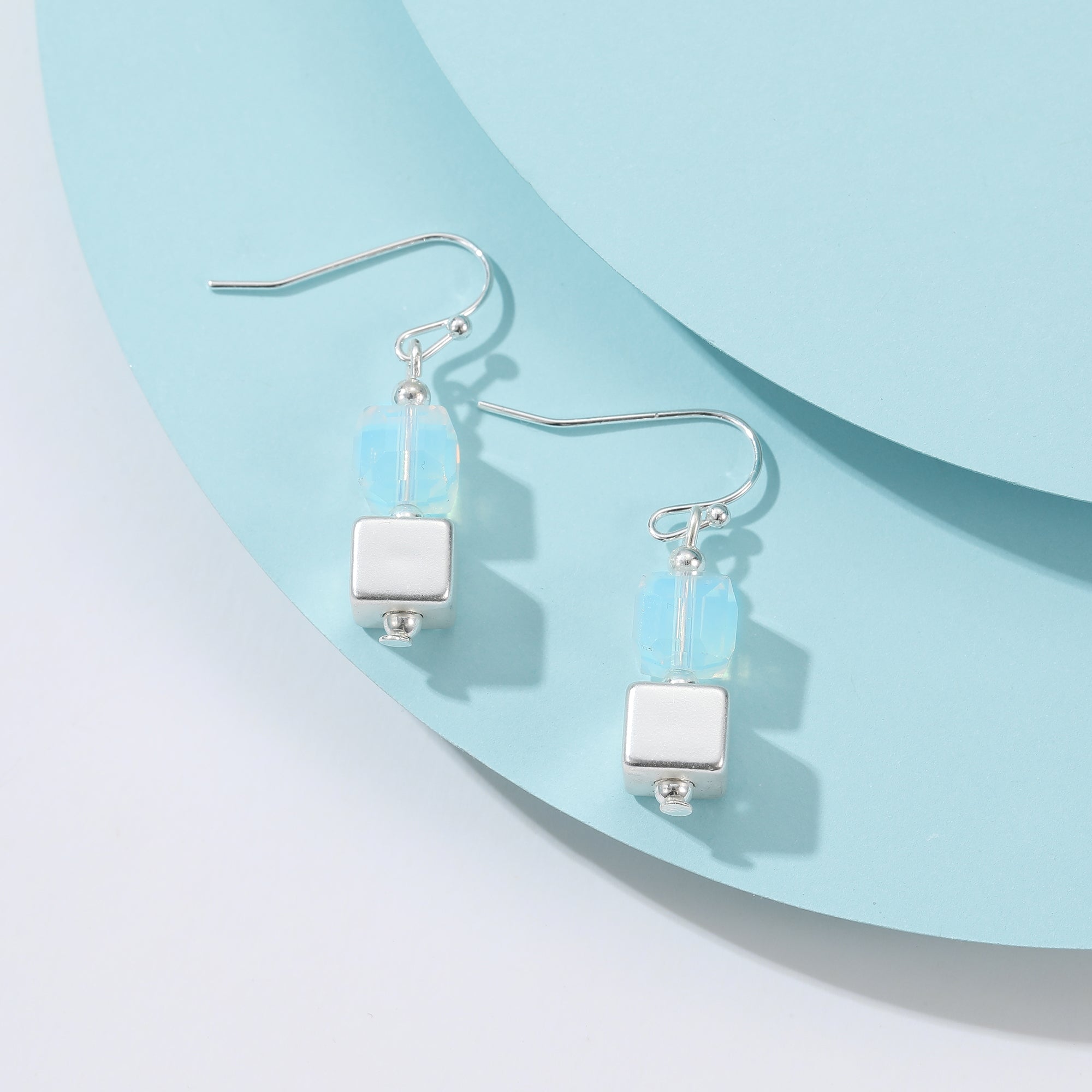 Light Cube Earrings: silver dangle with light blue glass bead and cube