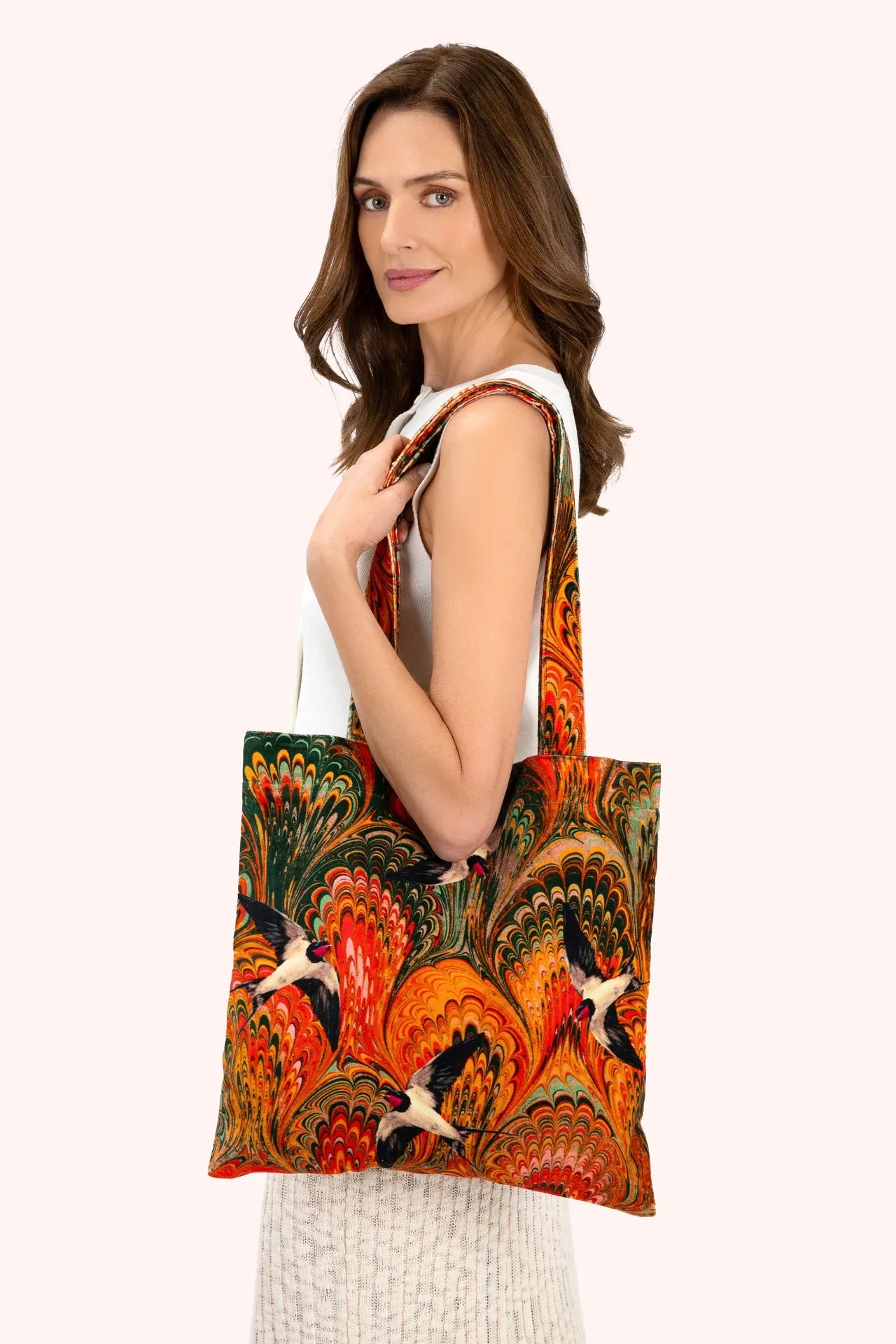 Vibrant Marbled Swallows Velvet Tote Bag with swirling orange-green pattern and flying birds