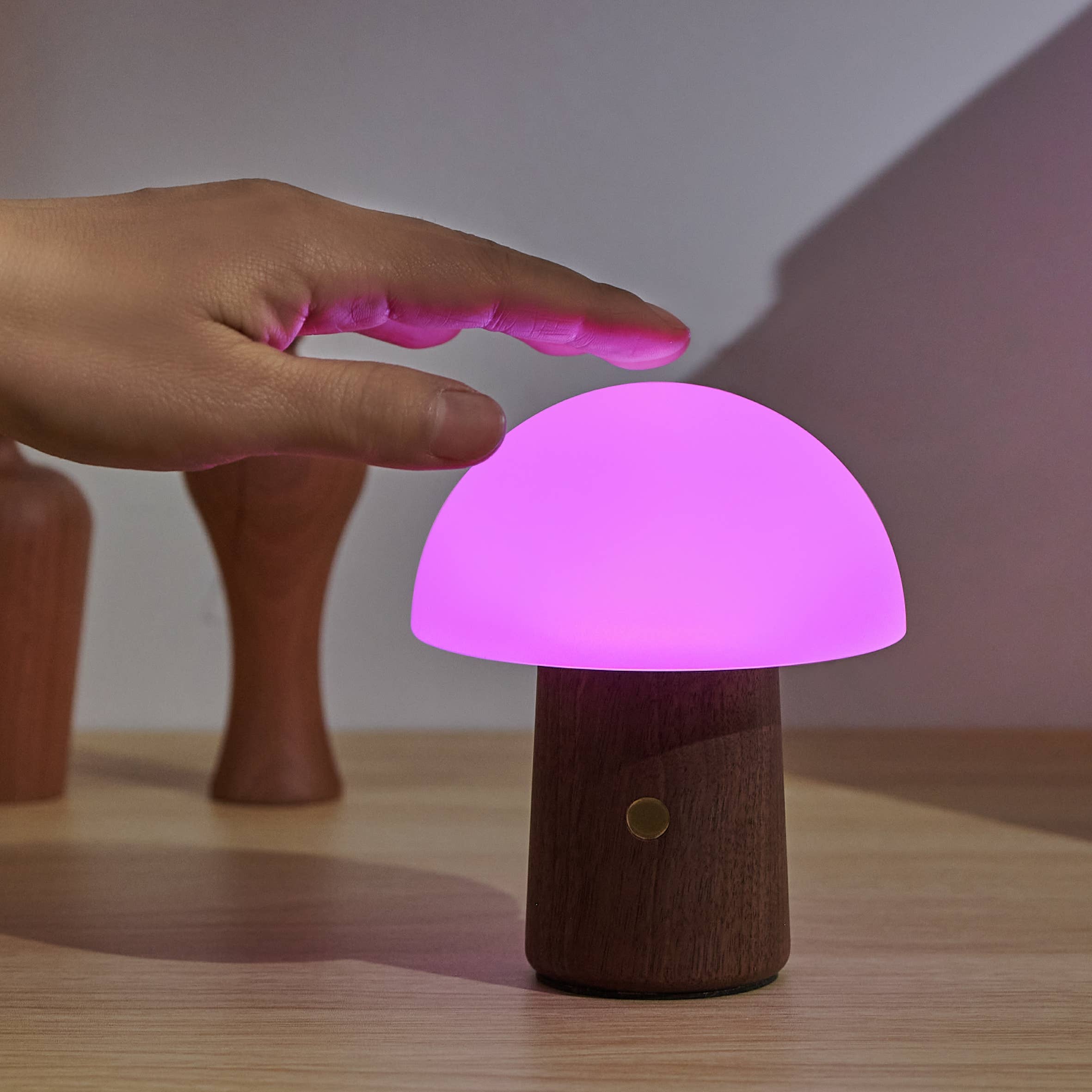 Mini Alice Mushroom Lamp in walnut with glowing pink shade and dark wood base
