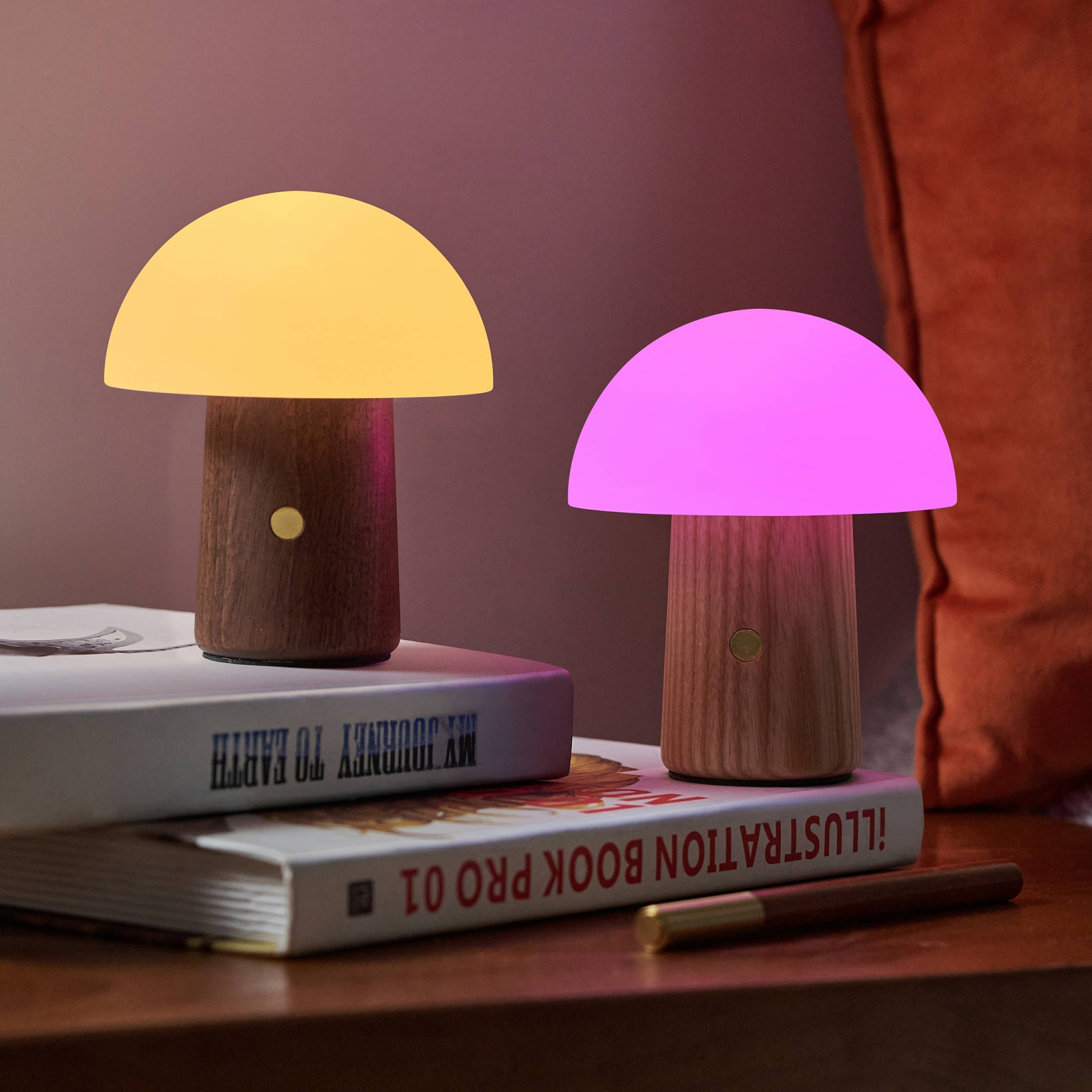 Mini Alice Mushroom Lamps in walnut with warm yellow and pink glow