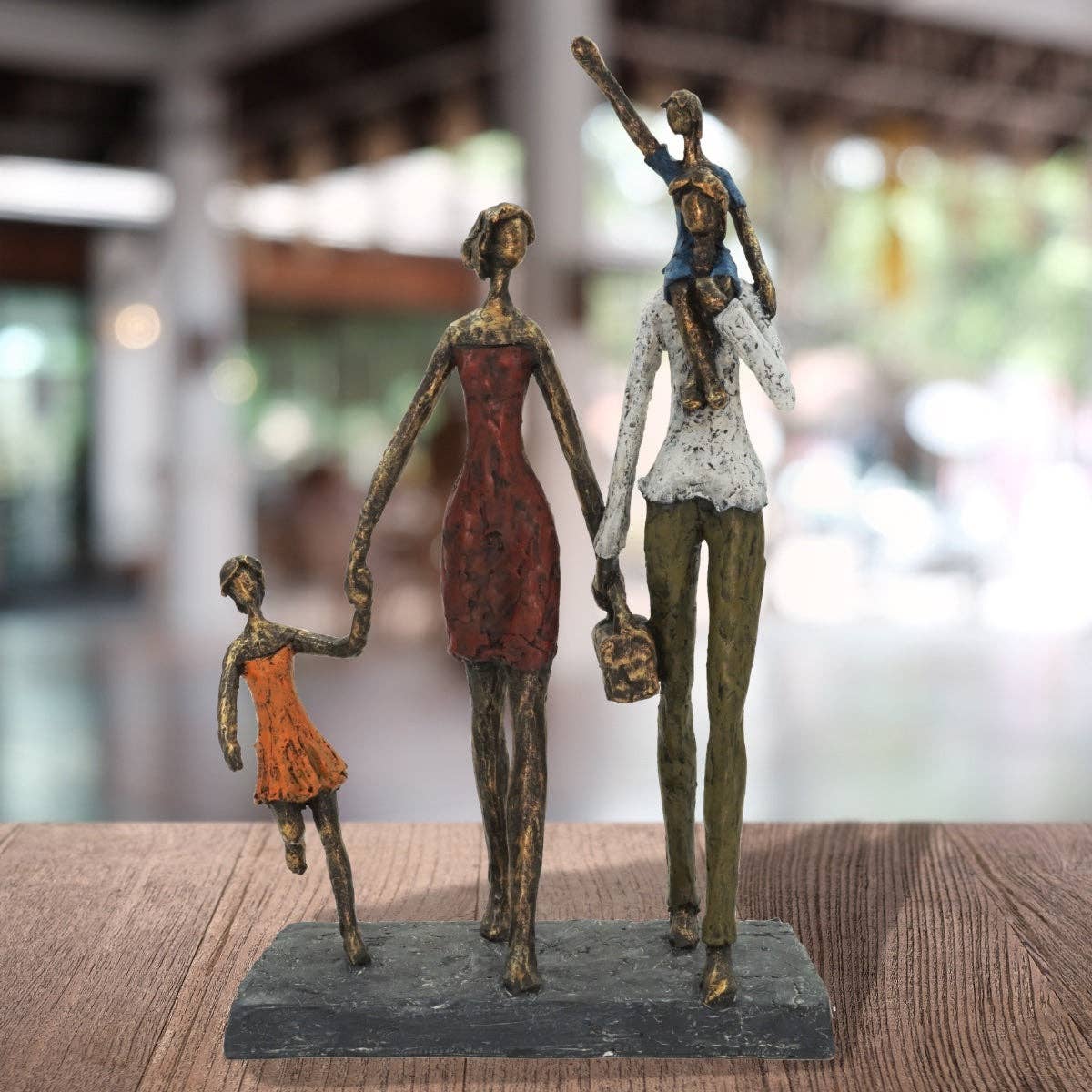 Bronze-toned Picnic in the Park family figurine with red dress and kids