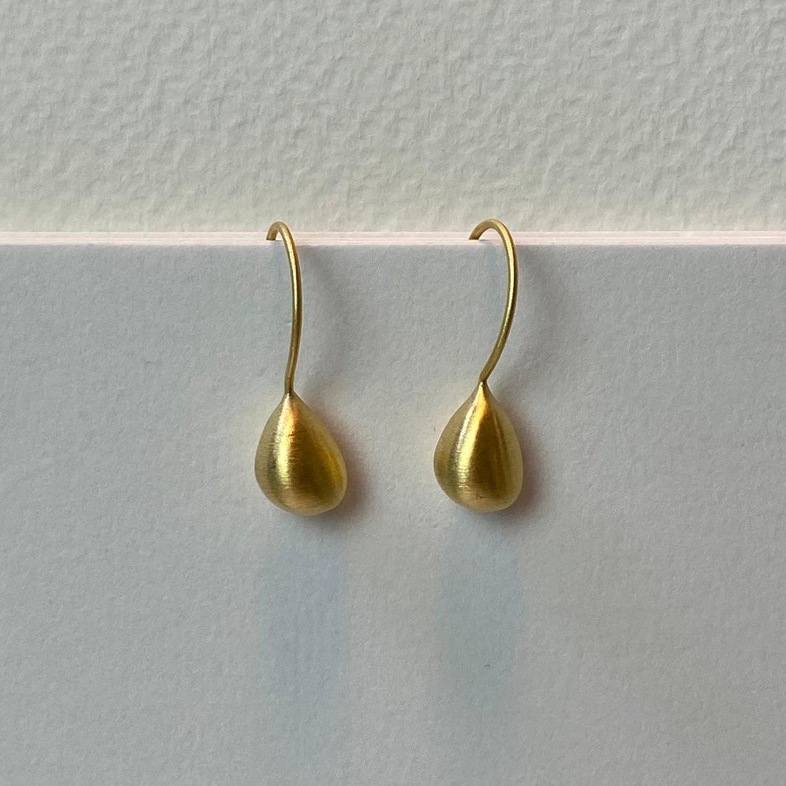 Satin gold teardrop earrings with matte finish and hook backs