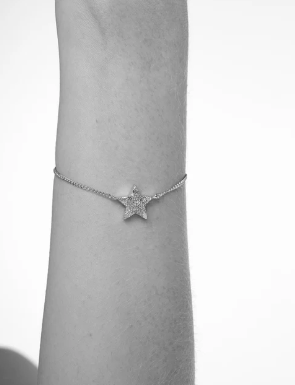 Delicate star-shaped Silver Cosma Bracelet with pave diamonds on arm