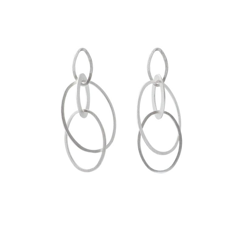 Silver-toned minimalist drop earrings with interlocking circular rings