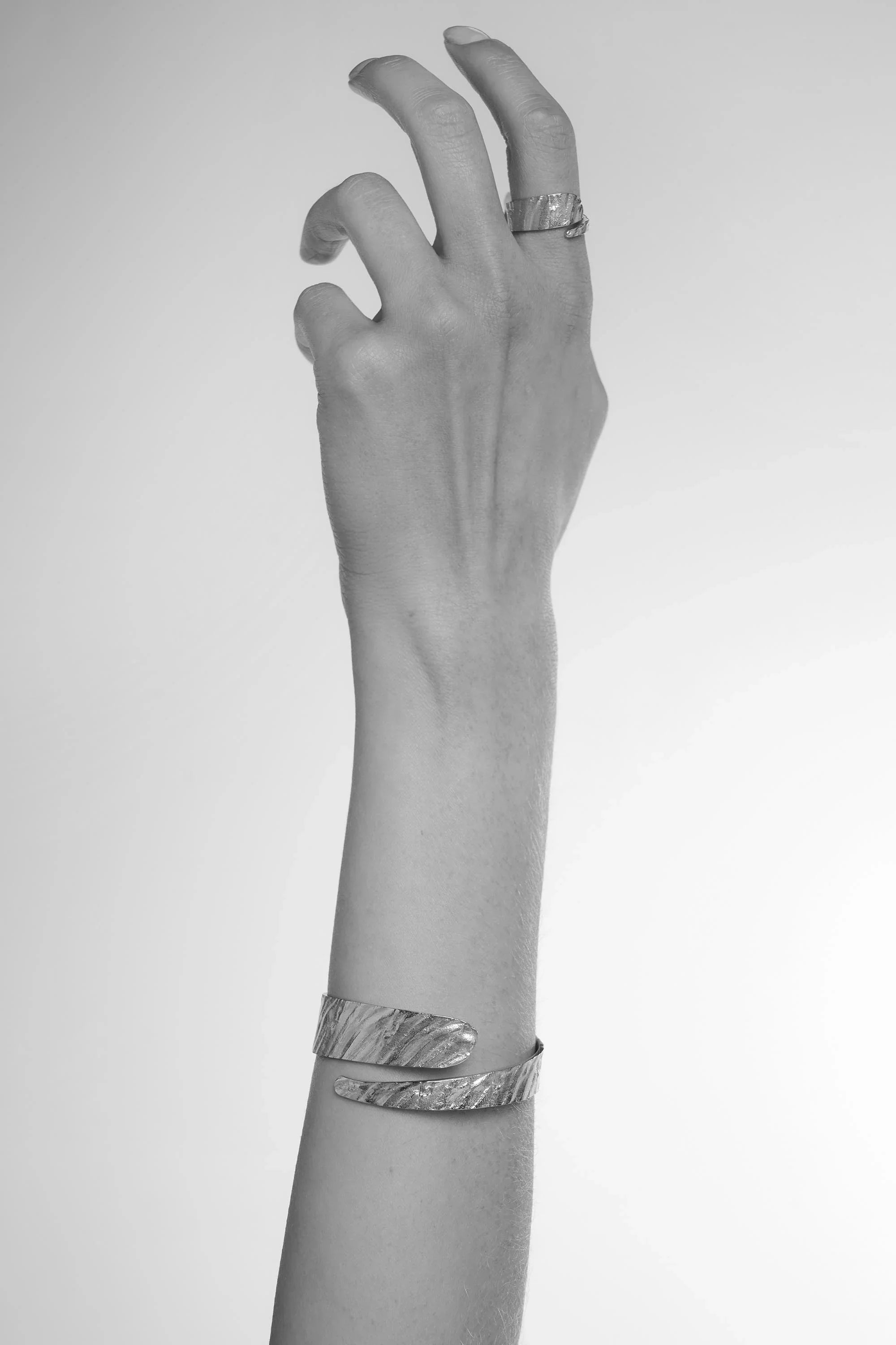 Silver Riva Bangle: textured silver wrap bracelet with modern design