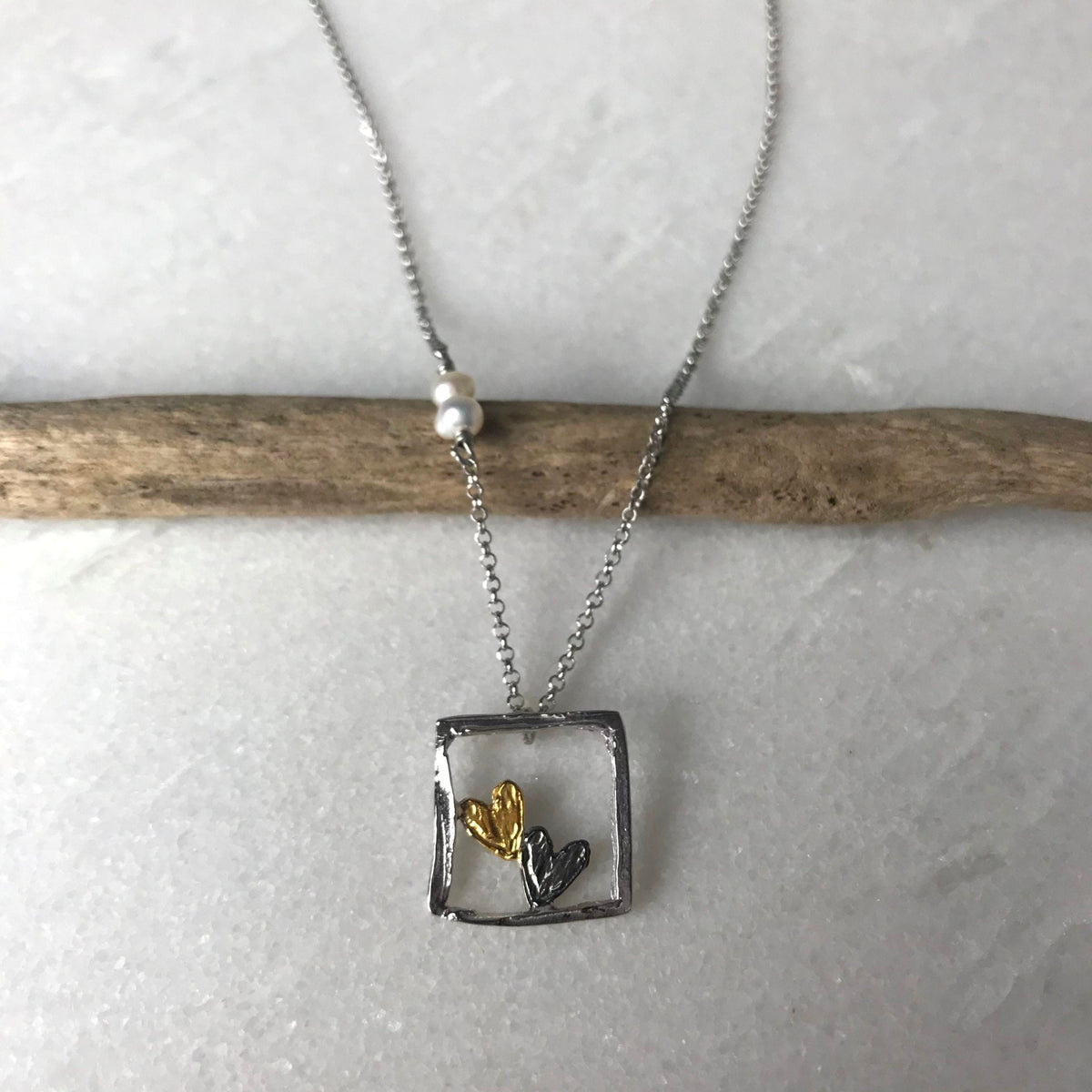 Square Heart Necklace with gold and black heart charms