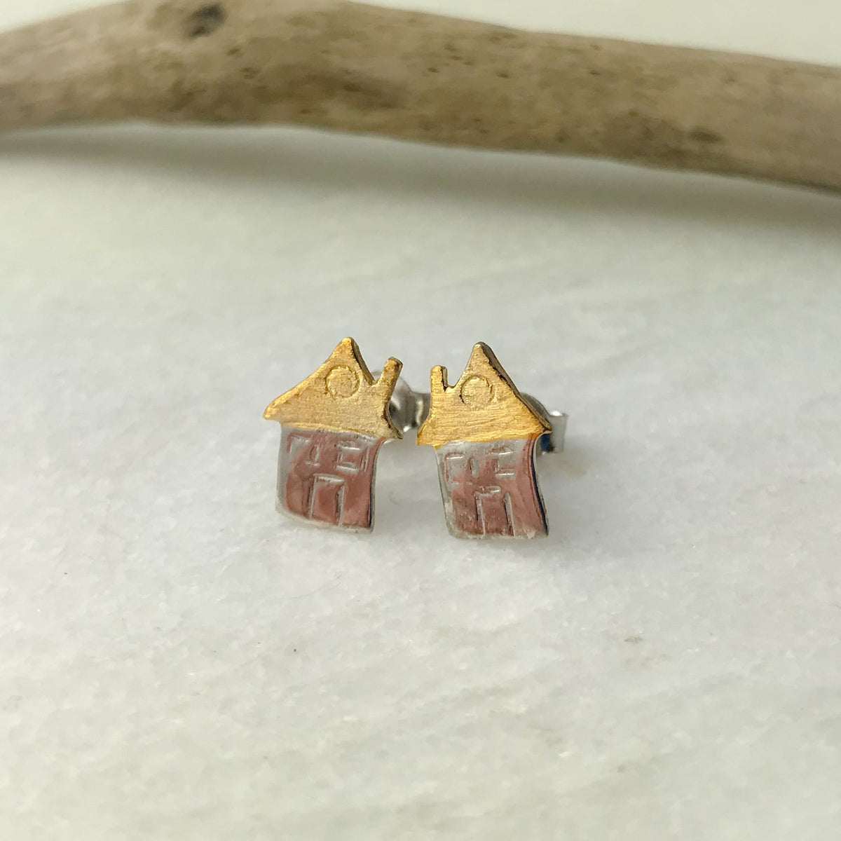 Cute tiny house stud earrings with gold roofs and pink enamel walls
