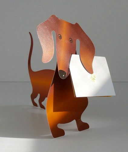 Copper dachshund figurine holding white envelope for Weeny Dog Card