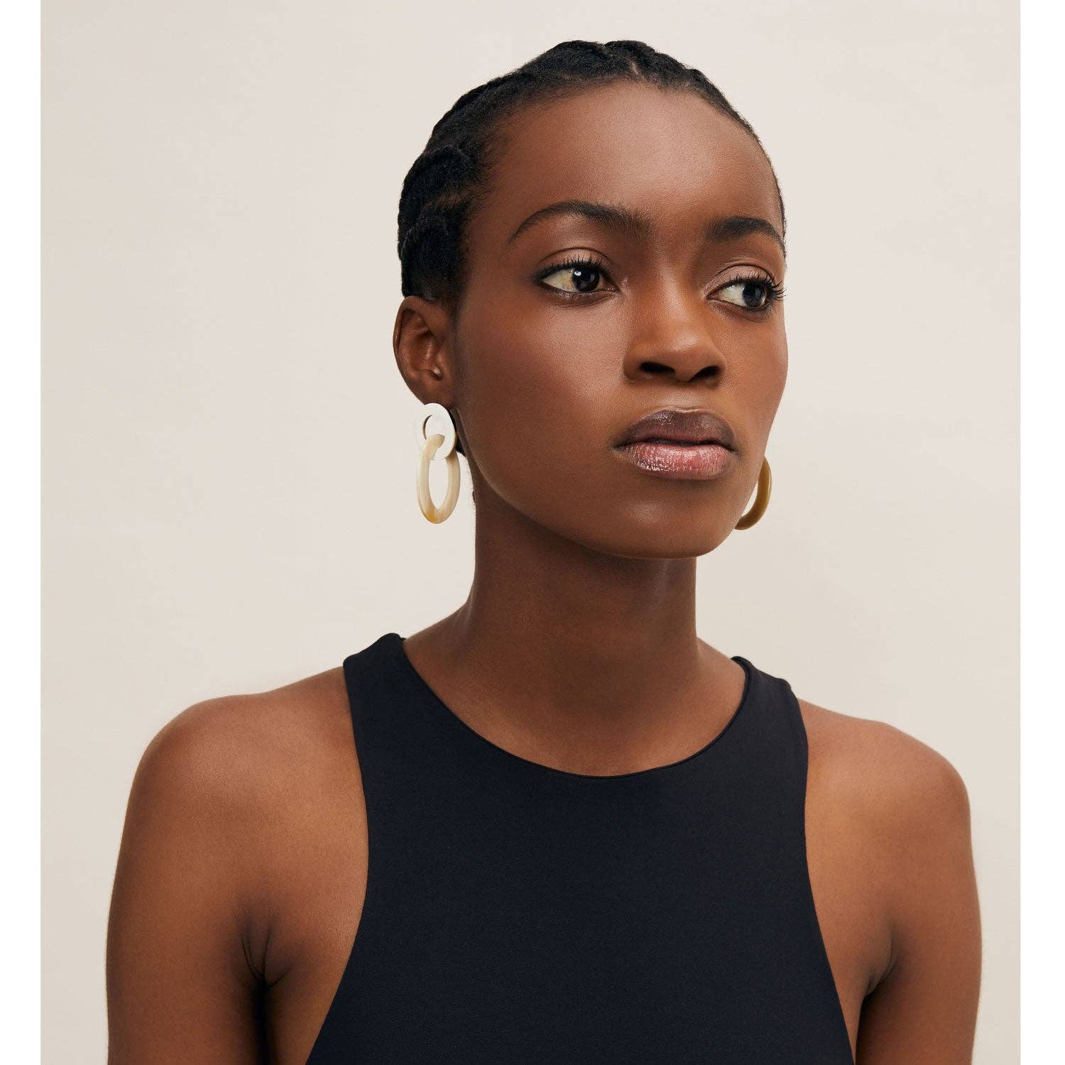 Cream-colored minimalist white horn hoop earrings with glossy finish